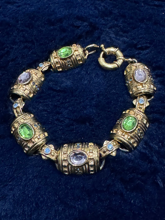 Premier Designs gold-toned barrel link bracelet with pastel green, purple, and blue rhinestones